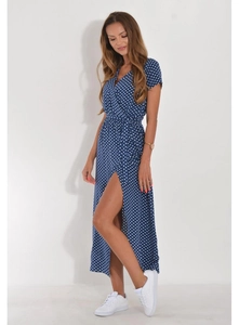 Detail of V-neck wrap dress with blue and white polka dots showing high slit and belted waist