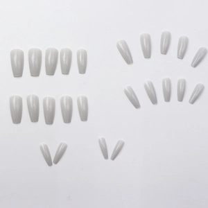 Glossy light gray long coffin press-on nail kit with multiple sizes on white background