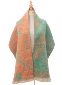 Close-up of wool blend jacquard floral scarf with orange and green abstract patterns