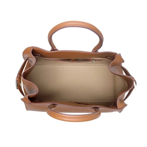 Brown leather tote bag with spacious interior and zipper pocket viewed from above