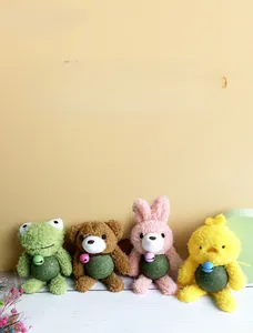 Macro detail of four plush catnip toys with bells in frog, bear, rabbit, and chick shapes