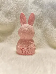 Detailed view of pink 3D printed Easter bunny with intricate hollow mesh pattern