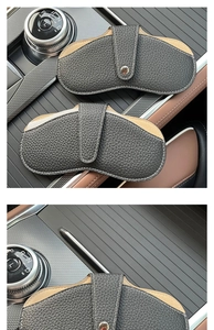 Car eyeglass storage case in black and tan lychee grain leather with metal snap button