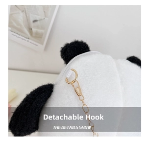 Detail of detachable gold metal hook and black white plush fabric on panda bag
