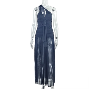 Detail of navy blue one-shoulder dress showing stylish knot and layered mesh fabric texture