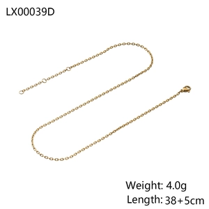 Detail view of gold snake chain necklace with lobster clasp and adjustable extension link
