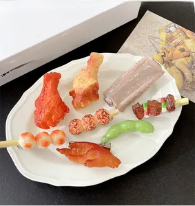 Macro shot of creative 3D realistic food-shaped hairpins made of resin on a white plate