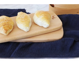 Close-up of polished Japanese beech wood cutting board with smooth rounded edges
