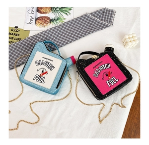 Detail of oil barrel bags with glitter blue and black finish and chain straps