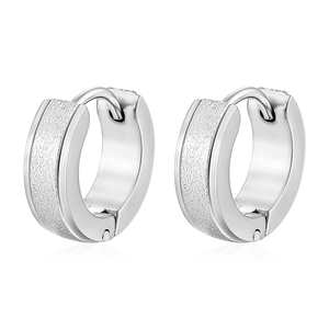 Detailed front view of silver textured huggie hoop earrings with polished edges
