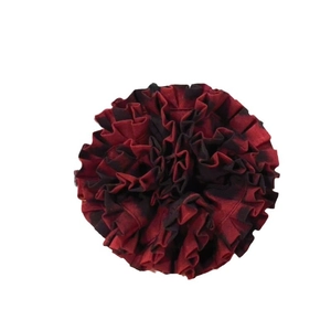 Elegant red and black plaid ruffled scrunchie hair accessory on a clean white background