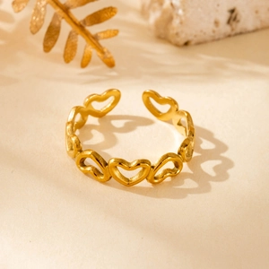 Adjustable gold stainless steel ring featuring hollow heart and angel wing motifs