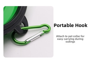 Detail of a green portable pet bowl showing the sturdy metal carabiner for outdoor travel