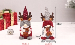 Détail de gnomes de Noël de 34cm avec chapeaux à paillettes et bois de renne sur boîtes rouges