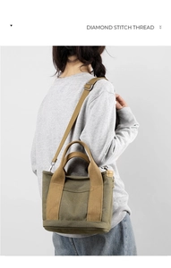 Model view of an olive green canvas bag showing its size and adjustable shoulder strap