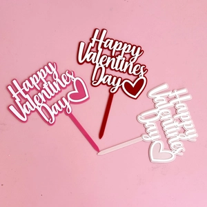 Three Happy Valentine's Day acrylic cake toppers in pink, red, and white colors