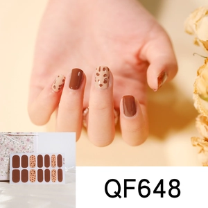 Detail of QF648 brown leopard print nail stickers showing professional application on hand