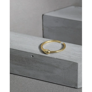 Minimalist S925 sterling silver open ring featuring a polished golden waterdrop teardrop design