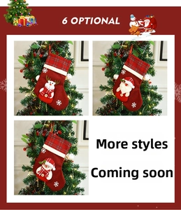 Detail of Christmas stocking gift bag with 3D Santa, reindeer, and snowman plush designs