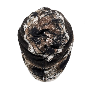 Detailed view of the jungle camouflage pattern on a soft breathable slouchy knit beanie