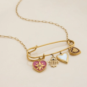 Detail of gold paperclip pendant with pink heart and Hamsa Hand charms on a gold chain