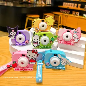 Sanrio characters cartoon camera keychains including Kuromi and Cinnamoroll on a white stand
