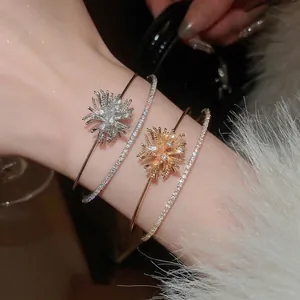 Elegant gold and silver firework zircon bangles set with starburst double-layered design