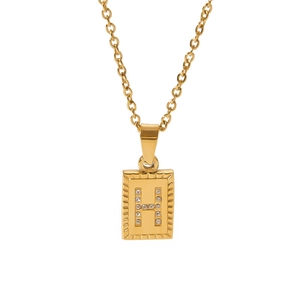 Detailed view of golden rectangle pendant with H initial zircon stones on O-chain