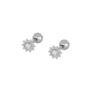 Detailed macro view of silver sunburst stud earrings with zircon and secure ball screw back