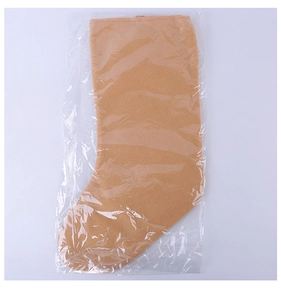 Close-up of brown felt Christmas stocking gift bag packed in clear plastic packaging