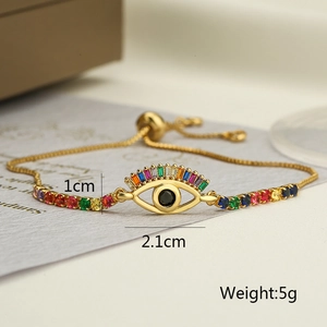 Detail view of gold-plated evil eye bracelet with dimension labels 2.1cm and 5g weight