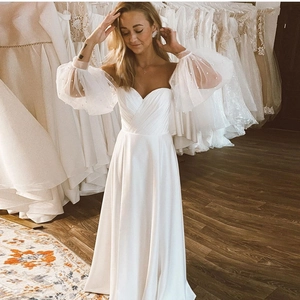 Elegant white A-line wedding dress with pearl bubble sleeves and pleated sweetheart bodice