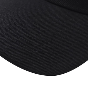 Close-up of premium black twill fabric and reinforced stitching on curved baseball cap brim
