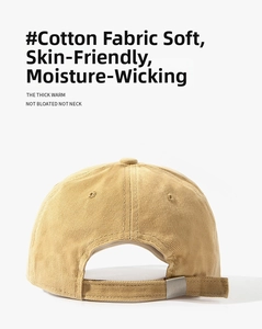 Detail of adjustable cotton strap and silver metal buckle on khaki baseball cap