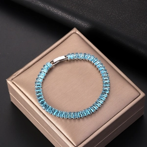 Fashionable tennis bracelet with light blue rectangular zircon stones and silver finish