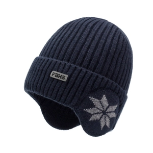 Men's winter knit beanie hat with earflaps and fleece lining in navy blue snowflake design