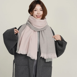 Two-tone pink and grey faux cashmere scarf with fringes shown on a model