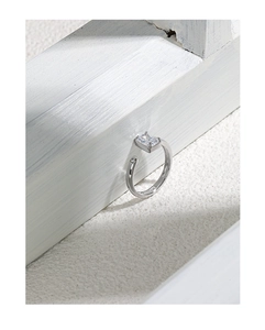 Macro shot of a S925 sterling silver open ring with a square-cut sparkling zircon