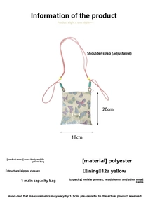 Detailed view of cream butterfly phone bag with pink adjustable strap and zipper closure
