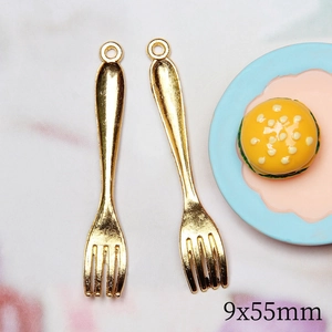 Detailed view of two 9x55mm golden alloy fork charms with top loops for DIY dollhouse
