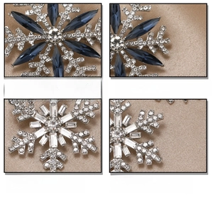 Macro detail of snowflake brooch with blue marquise crystals and AAA rhinestones