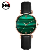 Detail of Hannah Martin watch with green malachite dial and black leather strap