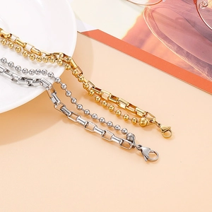 Dual-layer stainless steel bracelet featuring golden and silver bead and box chains