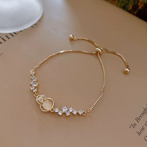 Bracciale regolabile in oro con pietra occhio di gatto gialla e zirconi