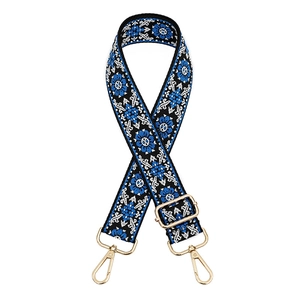 Ethnic style woven shoulder strap with blue white patterns and gold metal hardware