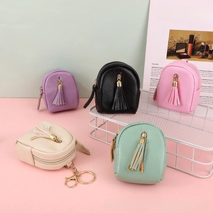 Miniature backpack coin purses in five colors with tassels and metal keychains