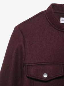 Close-up of wine red wool jacket collar and shoulder with high-quality fabric texture