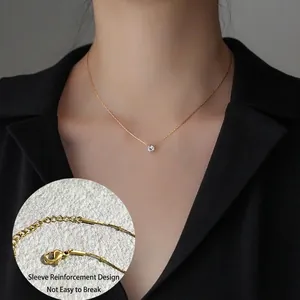 Elegant gold six-prong solitaire diamond pendant necklace for women on black outfit