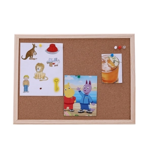 Hanging cork bulletin board with wooden frame and colorful pushpins for photos