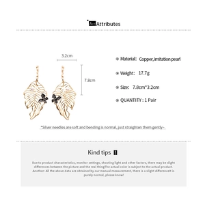 Detailed size chart for gold leaf earrings with butterfly accent and pearl pendant